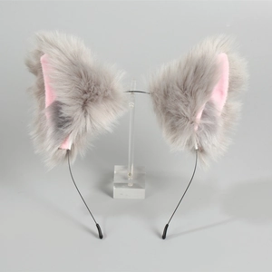 Close-up of handmade Lolita cat ears headband with grey and pink faux fur on stand