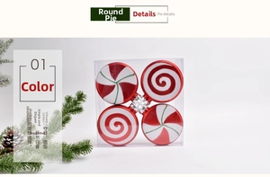 Detail of four red and white peppermint candy Christmas ornaments in a transparent box