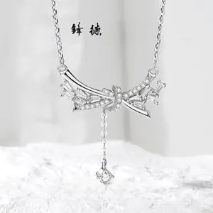 Close-up of S925 sterling silver bow necklace with sparkling zircon pendant detail