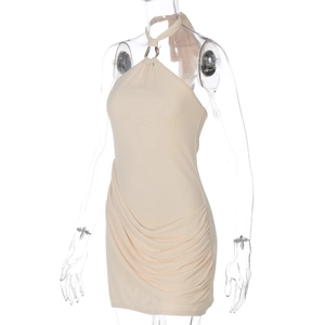 Detail showing side ruching and fabric texture of a beige halter neck bodycon mini dress