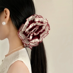 French style oversized lace scrunchie in burgundy and white on model side view