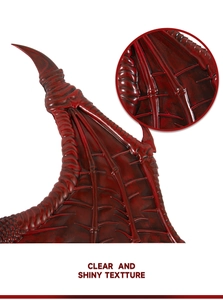 Close-up of realistic dark red dragon wing texture and detailed bone structure for cosplay