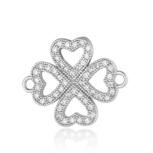 Macro detail of silver clover jewelry connector with micro-paved sparkling cubic zirconia