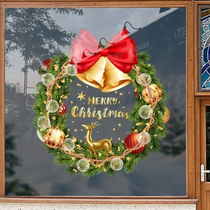 Christmas wreath window sticker with gold reindeer and red bow for festive glass decoration