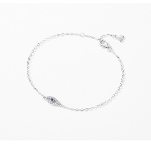 Macro shot of silver Evil Eye bracelet with blue stone and sparkling cubic zirconia pavé