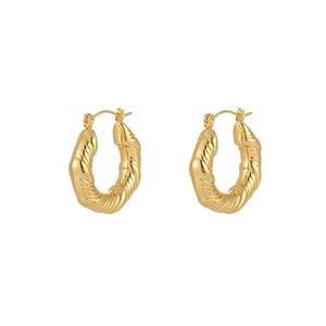 Detailed close-up of chunky gold-plated twisted rope hoop earrings on a white background