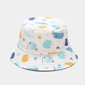 Detail of white cotton bucket hat featuring colorful sea creatures like fish and starfish