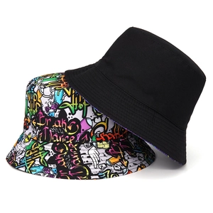 Double-sided reversible bucket hat featuring black fabric and vibrant street graffiti patterns