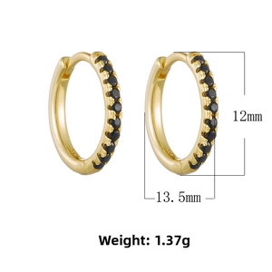 Macro detail of 925 silver gold-plated hoop earrings with black zircon pavé and sizing