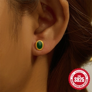 S925 sterling silver gold stud earring with green opal stone worn on model ear
