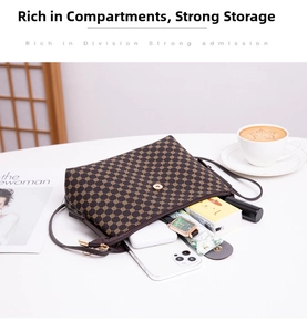 Detail view of small crossbody bucket bag with interior storage for phone and makeup