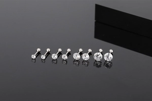 Detailed view of four sizes of S925 silver screw-back stud earrings with zircon crystals