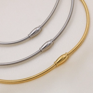 Thick snake chain necklace in gold and silver finish with magnetic oval clasp