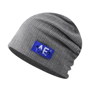 Grey ribbed knit beanie with blue AE logo patch, casual slouchy skull cap for men and women