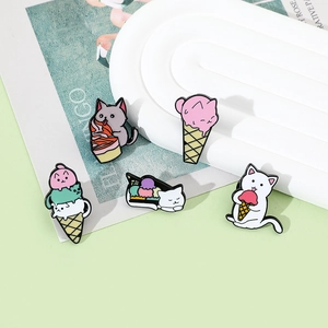 Detailed close-up of cute cartoon cat enamel pins featuring ice cream cone themes