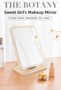 Detail of a rectangular wooden desktop makeup mirror with a minimalist Nordic design finish