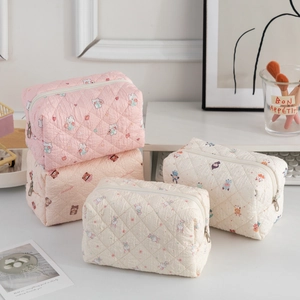 Quilted cotton makeup bag with cute rabbit and bear prints in a variety of soft colors