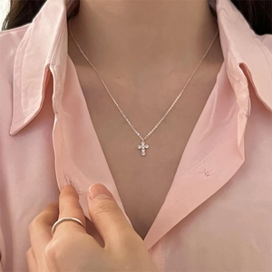 Minimalist 925 sterling silver cross pendant necklace with zircon worn by a model