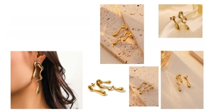 Detailed view of asymmetrical gold waterdrop earrings with an artistic fluid design