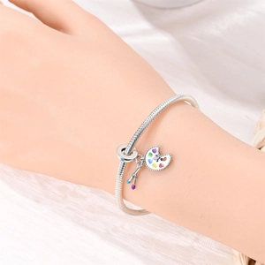 Artistic oil painting charm bracelet with silver palette and colorful enamel brushes