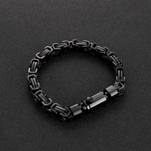 Detailed view of men's black Byzantine chain bracelet with a spring clasp closure