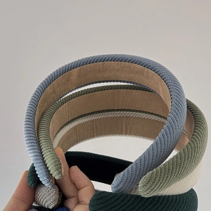 Close-up of colorful ribbed fabric headbands showing texture and vibrant color variety