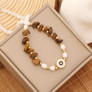 Bohemian natural stone necklace with irregular brown stones, white pearls, and eye pendant