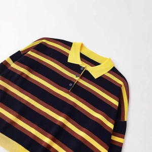 Knitted polo shirt with vintage yellow and navy stripes and a classic ribbed collar