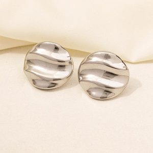 Detailed view of silver textured earrings with wave patterns and 304 stainless steel finish