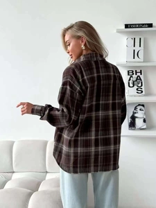 Brown and grey plaid flannel shirt featuring a loose fit and long sleeves for women