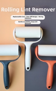 Detail of multi-color lint rollers with ergonomic handles and tear-off adhesive sheets