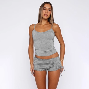 Detail view of grey two-piece camisole and drawstring shorts set with ruffle trim texture