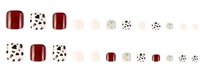 Detailed set of 24 press-on toenails featuring red, white, and cow print patterns