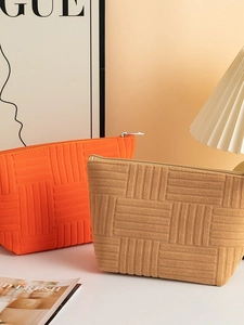 Large capacity towel fabric cosmetic bag with geometric texture in orange and brown
