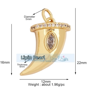 Macro shot of gold horn pendant with inlaid crystals and detailed dimension measurements