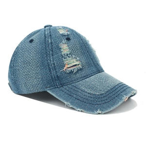 Distressed blue denim baseball cap with rainbow stitching and vintage ripped details