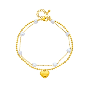 Elegant gold double-layered heart anklet with white beads and Love engraving