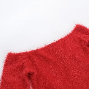 Detailed view of red faux fur off-shoulder neckline with a concealed zipper