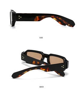 Detail of square sunglasses with gold rivet accents and tortoise pattern on temples