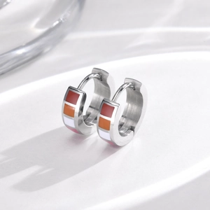 Detail of lesbian pride flag enamel hoops in polished silver stainless steel