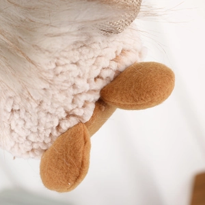 Christmas gnome plush ornament featuring white faux fur and warm knit details