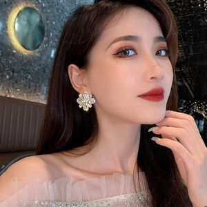 Luxury oversized flower crystal earrings with sparkling rhinestones on a gold metal base