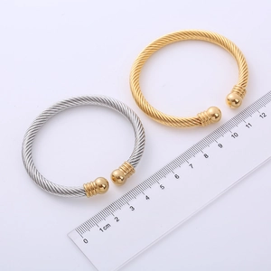 Polished cable wire open cuff bracelets in gold and two-tone finishes with ruler