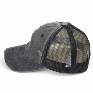 Close-up of dark grey distressed canvas baseball cap with breathable black mesh back