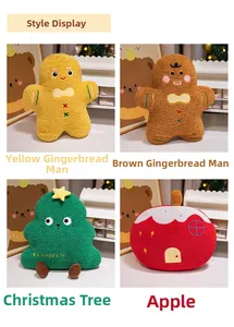Detail of Christmas plush pillows featuring gingerbread man, tree and apple in soft fleece