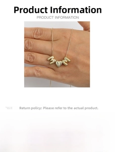 Macro view of 18k gold plated brass MOM necklace pendant showing 45cm chain length details