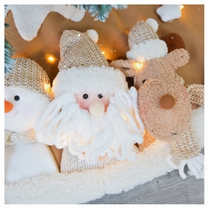 Close-up of knit Christmas plush figures with soft textures for festive holiday decor
