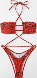 Detail of red snake skin bikini with cross neck ties and gold metal ring hardware