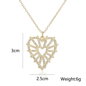 Detailed view of hollow heart pendant with zircon eye, 3cm height and 2.5cm width