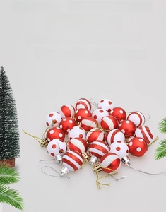 Close-up of red and white glitter Christmas balls with patterns for tree decoration